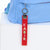 Racer Red Ribbon Keychain